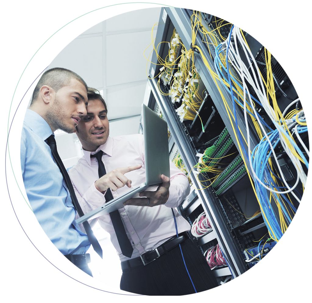 Two technicians by a server setting up Cloud Network Services