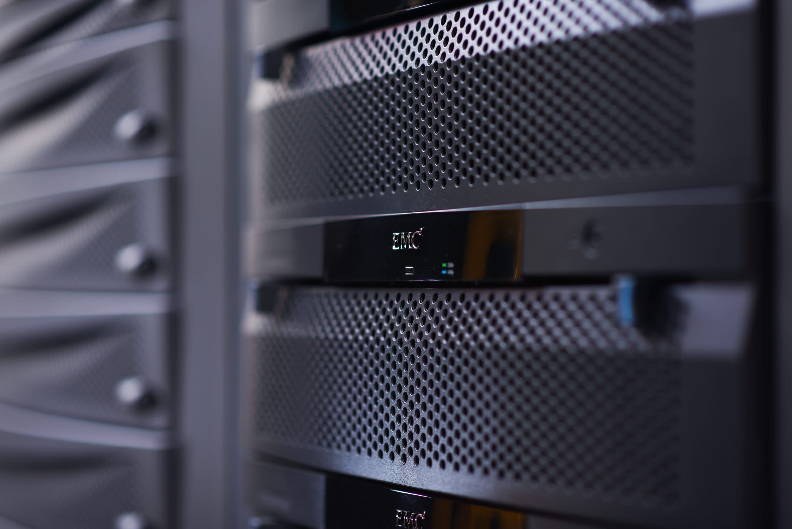 Photograph of servers in a rack, inside of a data centre