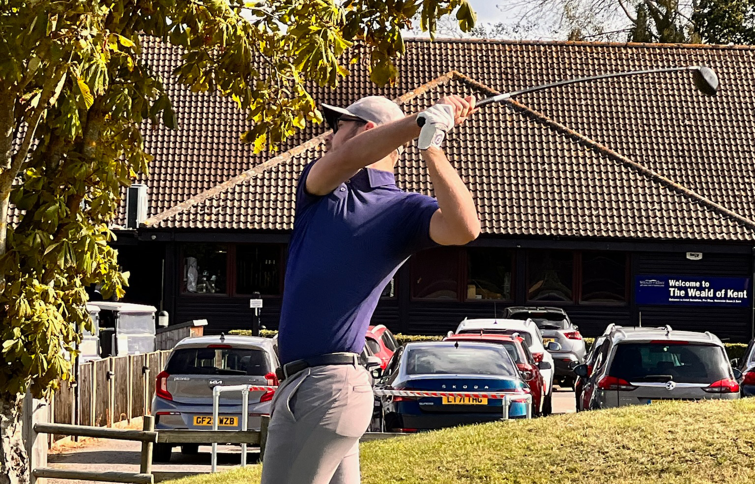 Photograph of a person playing golf at a charity golf event