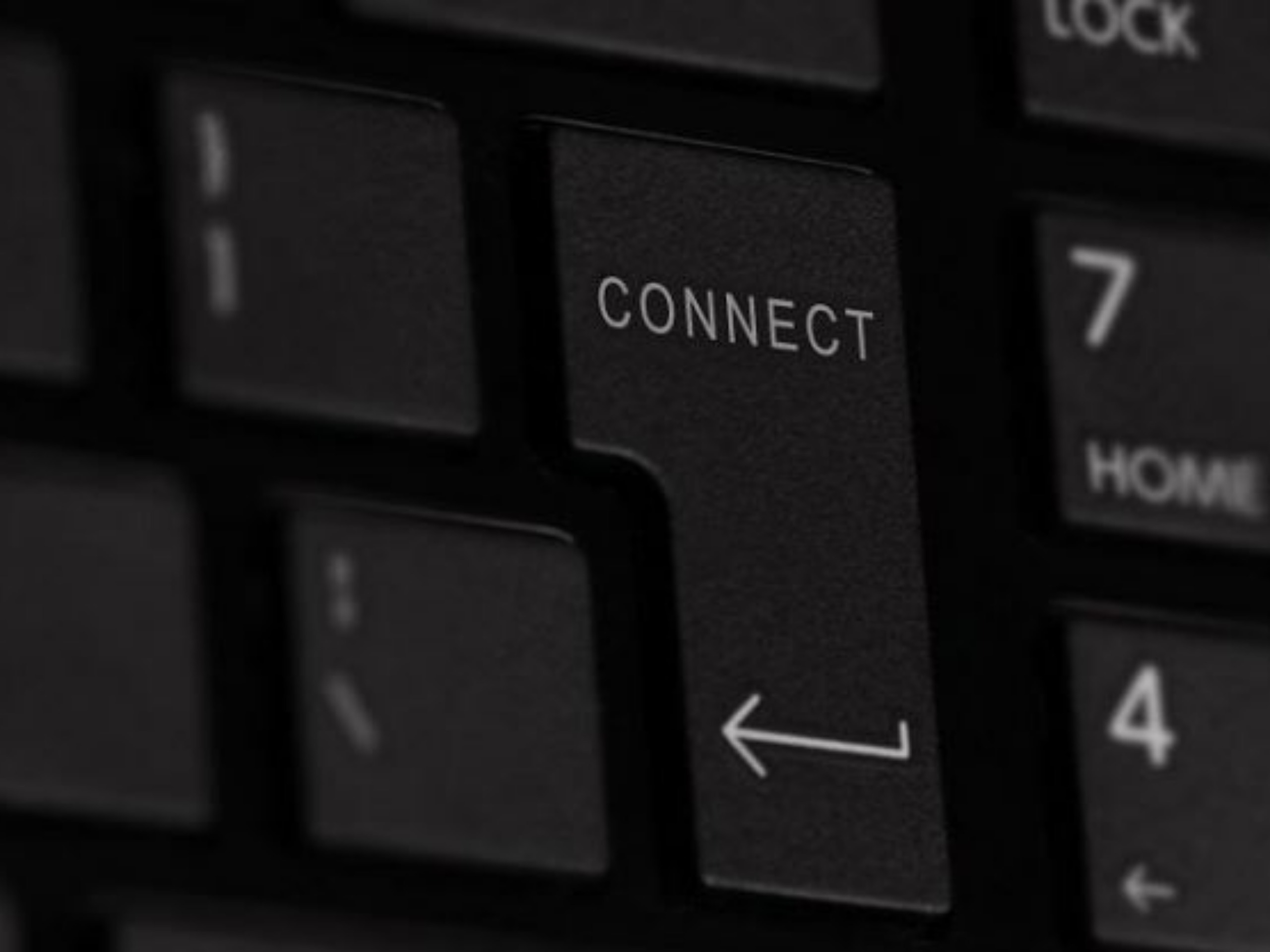 close up of enter key on a keyboard showing the word 'connect' and arrow